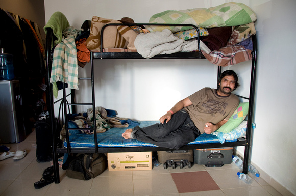 Many of the laborers live 8 - 10 to a room, like Raji